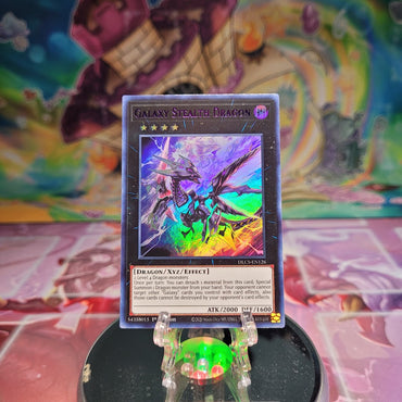 An Ultra Rare Purple "Galaxy Stealth Dragon" card from the Yugioh Set: Dragons of Legend: The Complete Series.