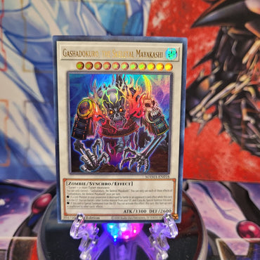 An Ultra Rare "Gashadokuro, the Skeletal Mayakashi" card from the Yugioh Set: Magnificent Mavens.