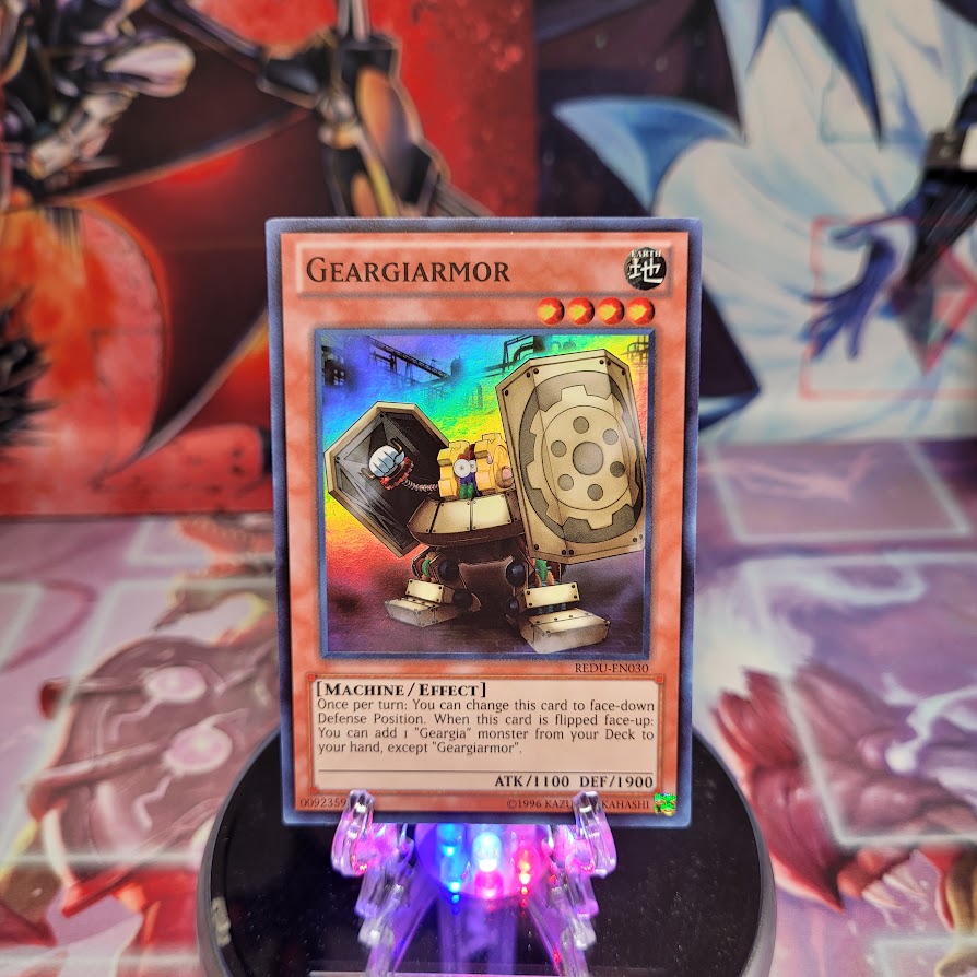 A Super Rare "Geargiarmor" card from the Yugioh Set: Return of the Duelist (REDU).