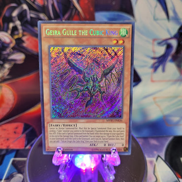 A Secret Rare "Geira Guile the Cubic King" card from the Yugioh Set: The Dark Side of Dimensions Movie Pack: Secret Edition.