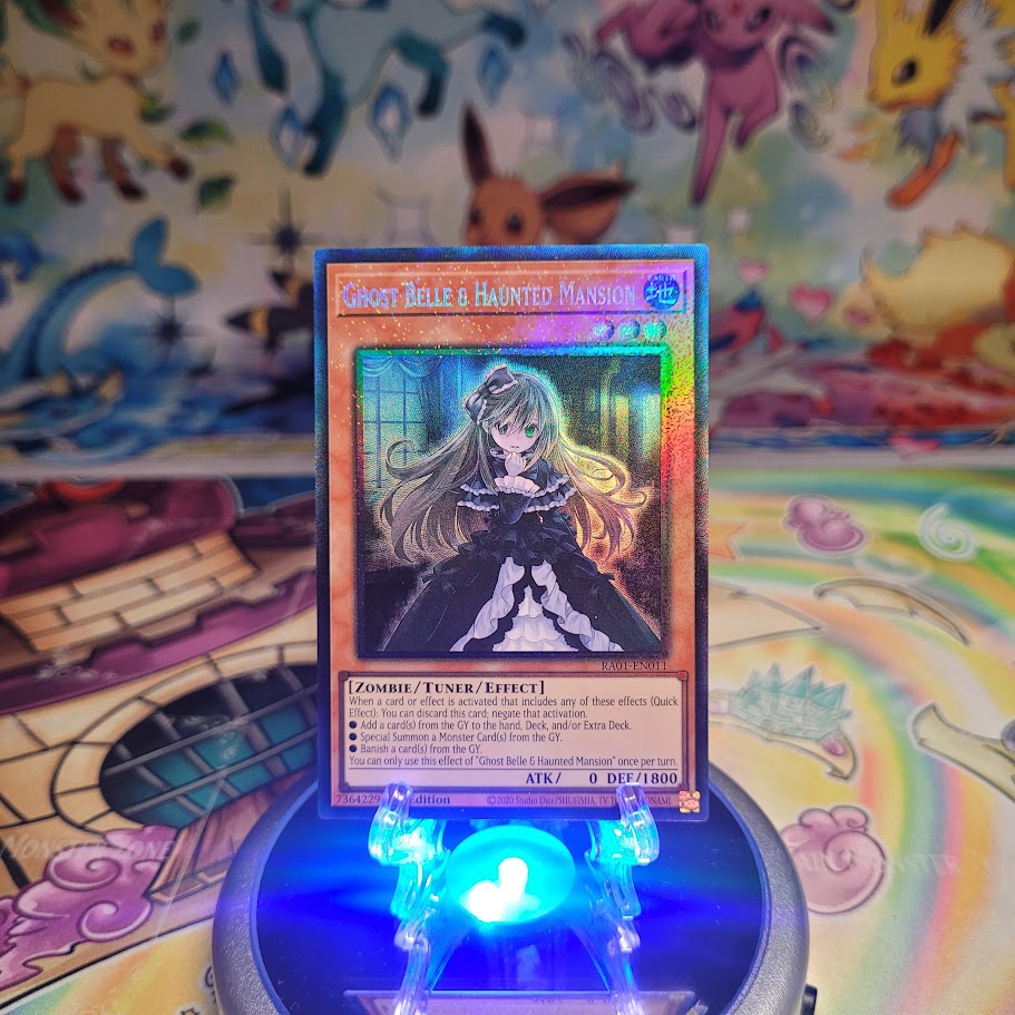 A Prismatic Collector's Rare "Ghost Belle & Haunted Mansion" card from the Yugioh Set: Rarity Collection 1 (RA01).