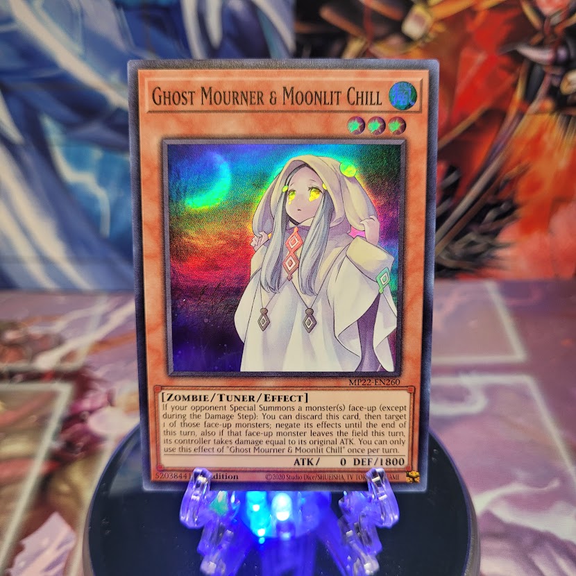 A Super Rare "Ghost Mourner & Moonlit Chill" card from the Yugioh 2022 Tin of the Pharaoh's Gods Set.