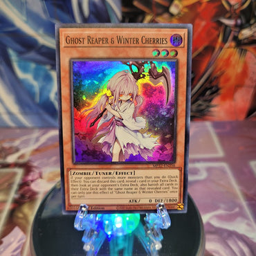 A Super Rare "Ghost Reaper & Winter Cherries" card from the Yugioh 2022 Tin of the Pharaoh's Gods Set.