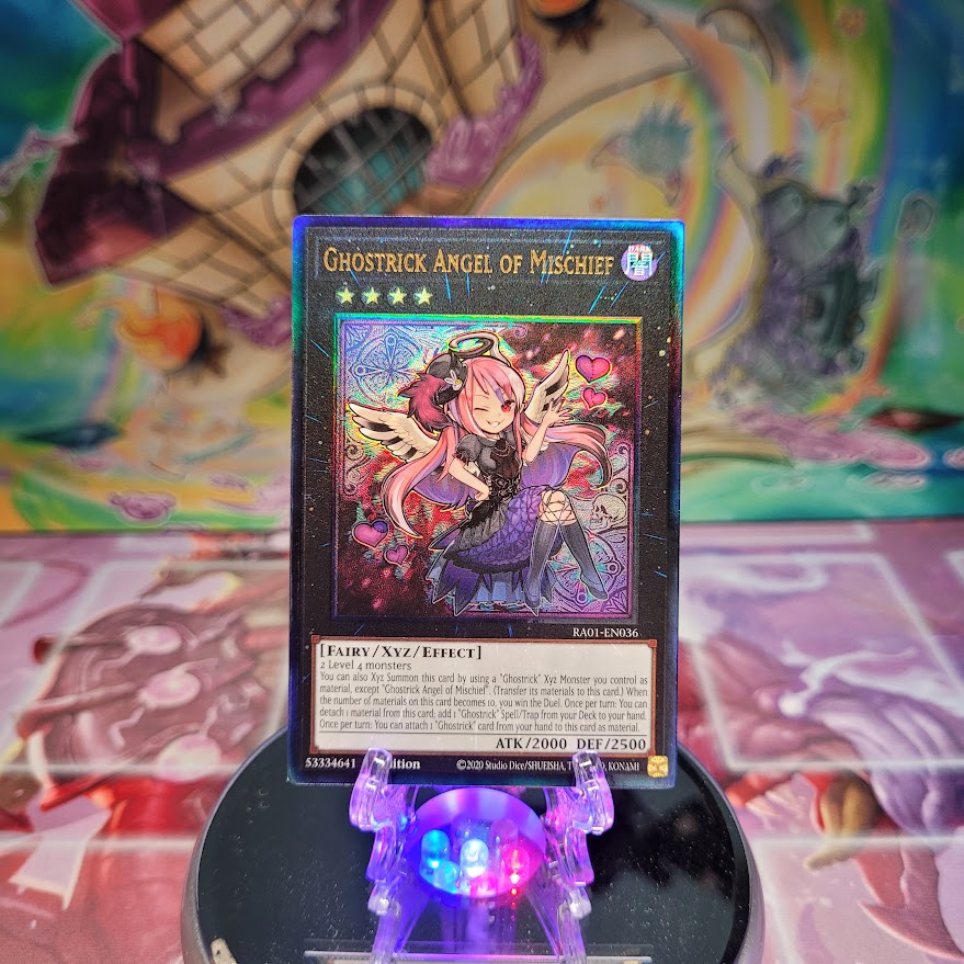 A Prismatic Ultimate Rare "Ghostrick Angel of Mischief" card from the Yugioh Set: Rarity Collection 1 (RA01).