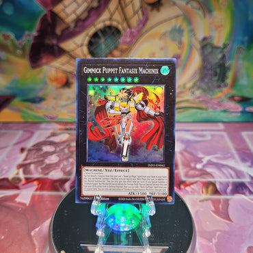 A Super Rare "Gimmick Puppet Fantasix Machinix" card from the Yugioh Set: The Infinite Forbidden.