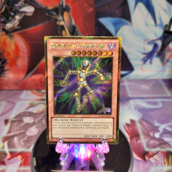 A Gold Secret Rare "Gimmick Puppet Magnet Doll" card from the Yugioh Set: Premium Gold (PGLD).
