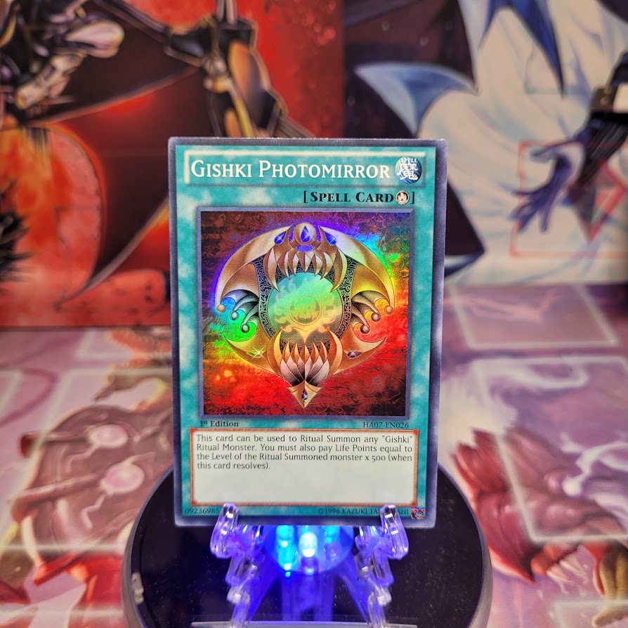 A Super Rare "Gishki Photomirror" card from the Yugioh Set: Hidden Arsenal 7: Knight of Stars (HA07).