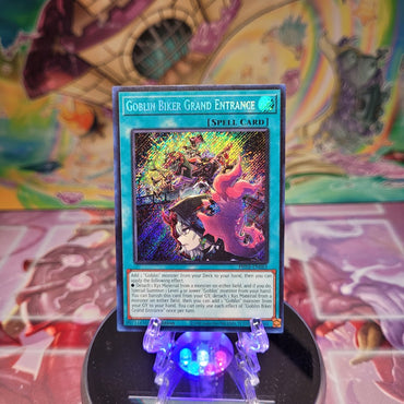 A Secret Rare "Goblin Biker Grand Entrance" card from the Yugioh Set: Phantom Nightmare.