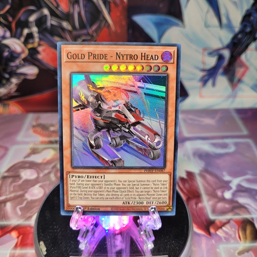 A Super Rare "Gold Pride - Nytro Head" card from the Yugioh Set: Photon Hypernova.