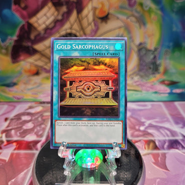 A Super Rare "Gold Sarcophagus" card from the Yugioh Set: Rarity Collection 2 (RA02).