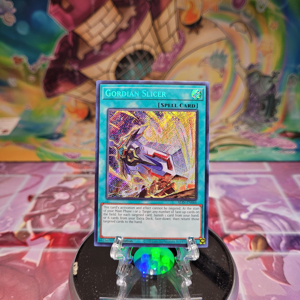 A Secret Rare "Gordian Slicer" card from the Yugioh Set: Alliance Insight (ALIN).