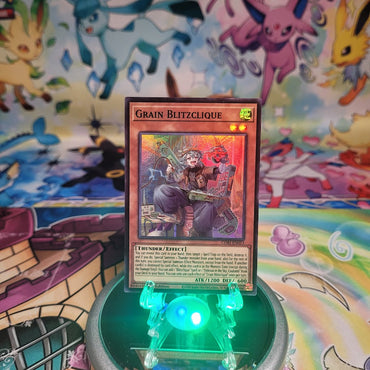 A Super Rare “Grain Blitzclique” card from the Yugioh Set: Chaos Origins (CORI).