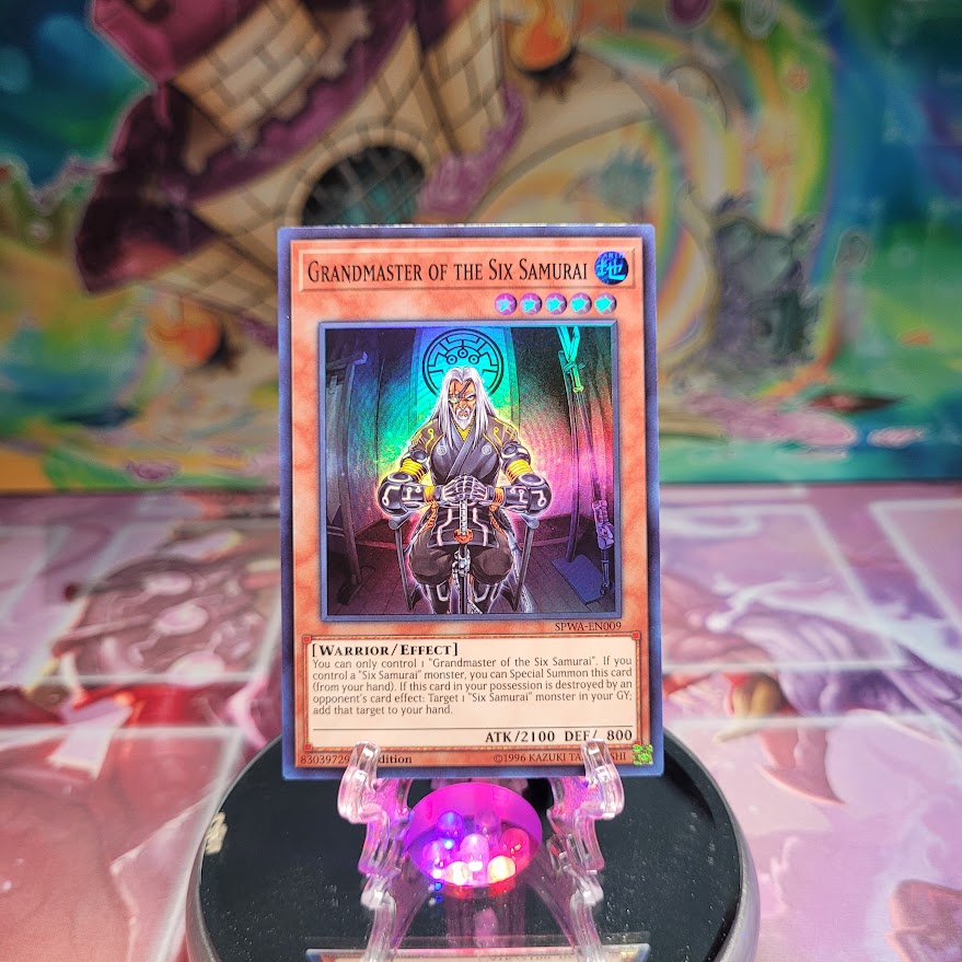 A Super Rare "Grandmaster of the Six Samurai" card from the Yugioh Set: Spirit Warriors.