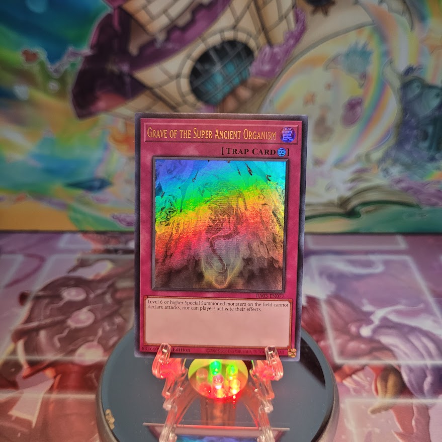 An Ultra Rare "Grave of the Super Ancient Organism" card from the Yugioh Set: Quarter Century Bonanza (RA03).