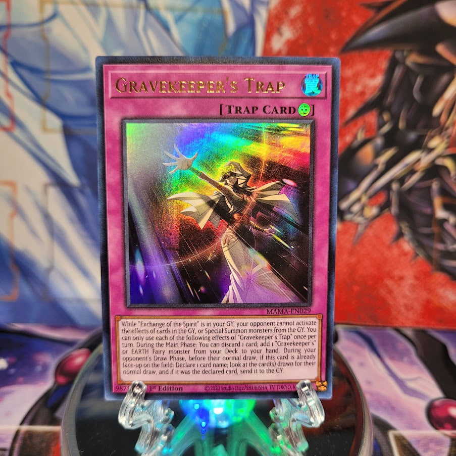 An Ultra Rare "Gravekeeper's Trap" card from the Yugioh Set: Magnificent Mavens.