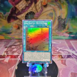 A Super Rare "Great Sand Sea - Gold Golgonda" card from the Yugioh Set: Blazing Vortex.