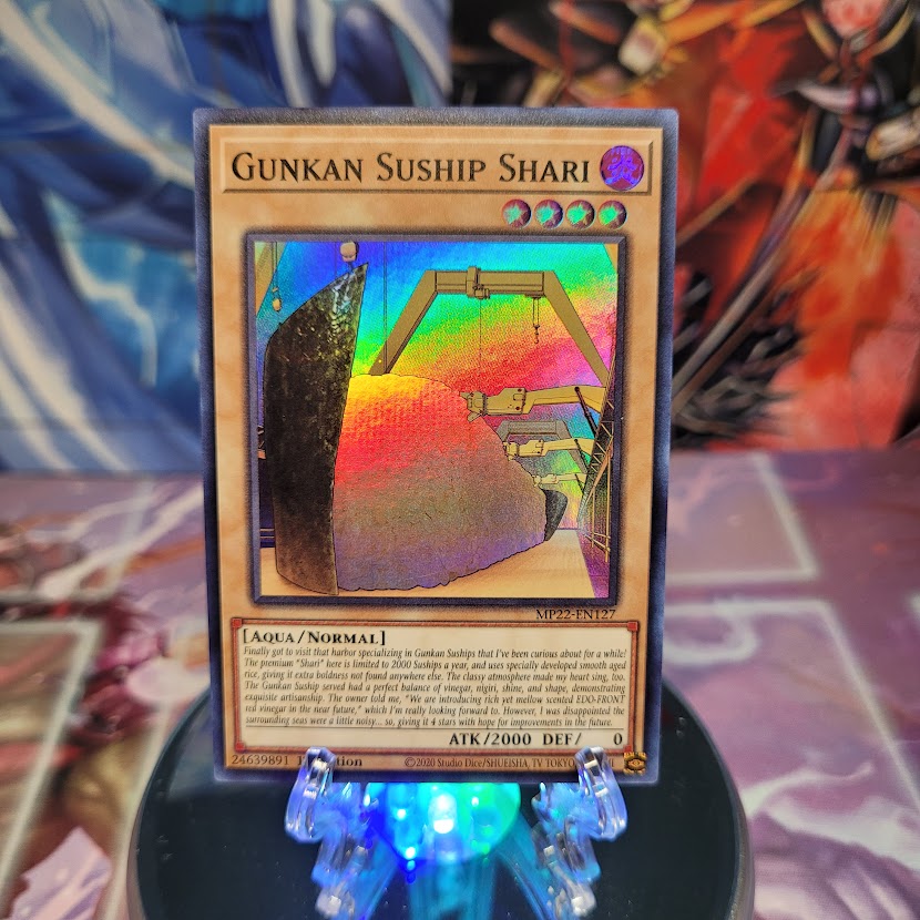 A Super Rare "Gunkan Suship Shari" card from the Yugioh 2022 Tin of the Pharaoh's Gods Set.