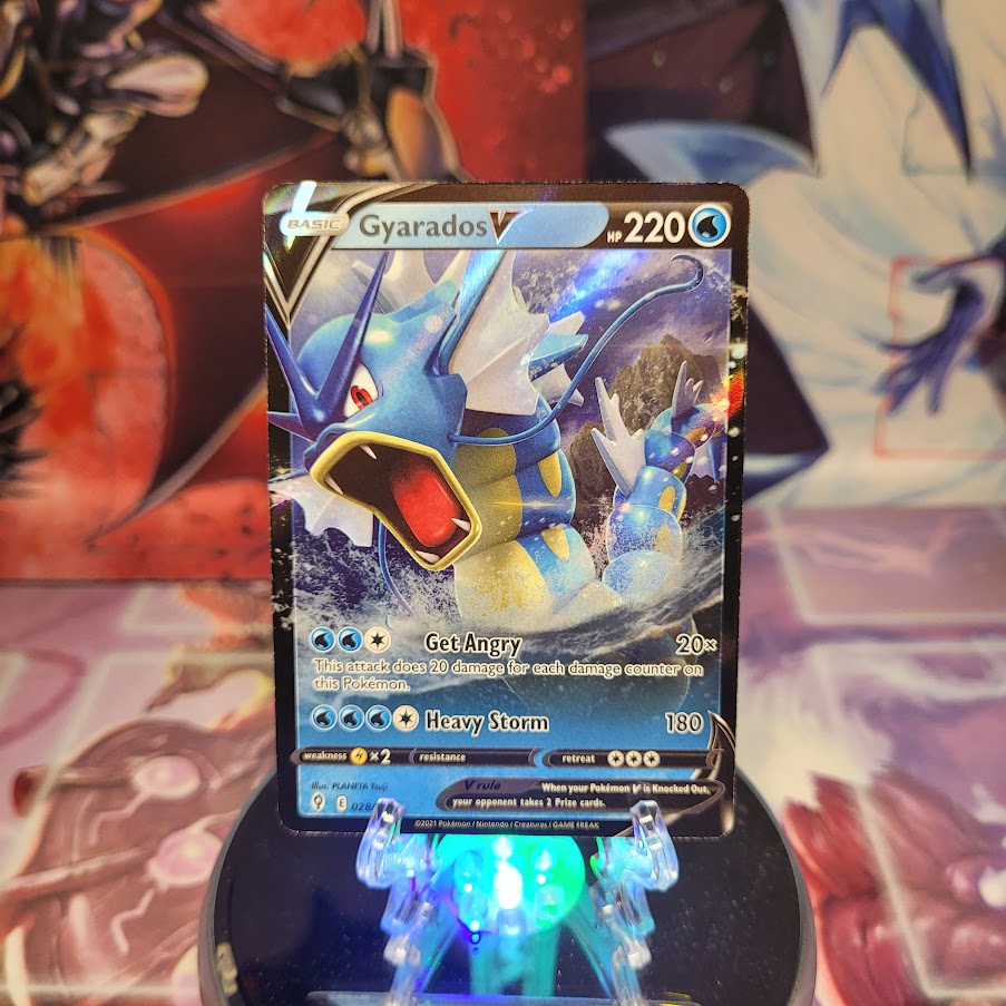 An Ultra Rare "Gyarados V" (028/203) card from the Pokemon Set: Evolving Skies.