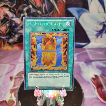 A Secret Rare "H - Heated Heart" card from the Yugioh Set: Ra-Yellow Mega Pack.