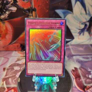 An Ultra Rare "Harpie's Feather Storm" card from the Yugioh Set: Rarity Collection 1 (RA01).