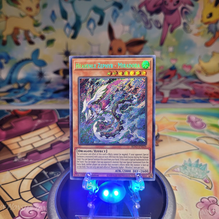 A Secret Rare "Heavenly Zephyr - Miradora" card from the Yugioh Set: Blazing Vortex (BLVO).