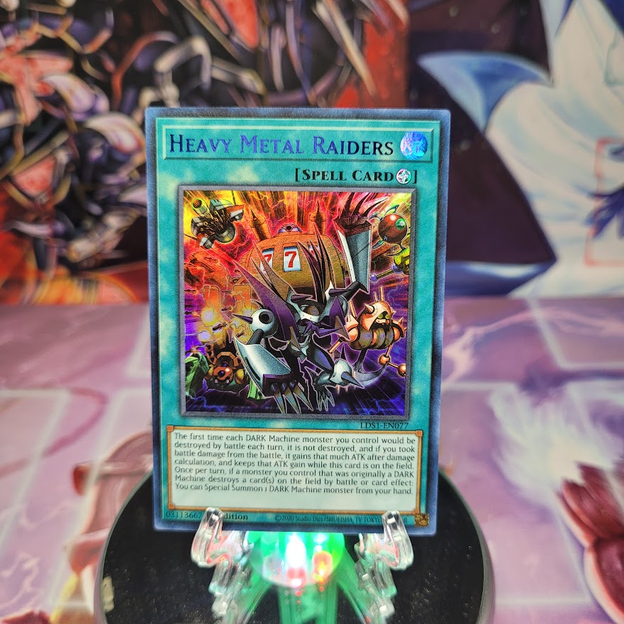 An Ultra Rare Blue "Heavy Metal Raiders" card from the Yugioh Set: Legendary Duelists: Season 1.