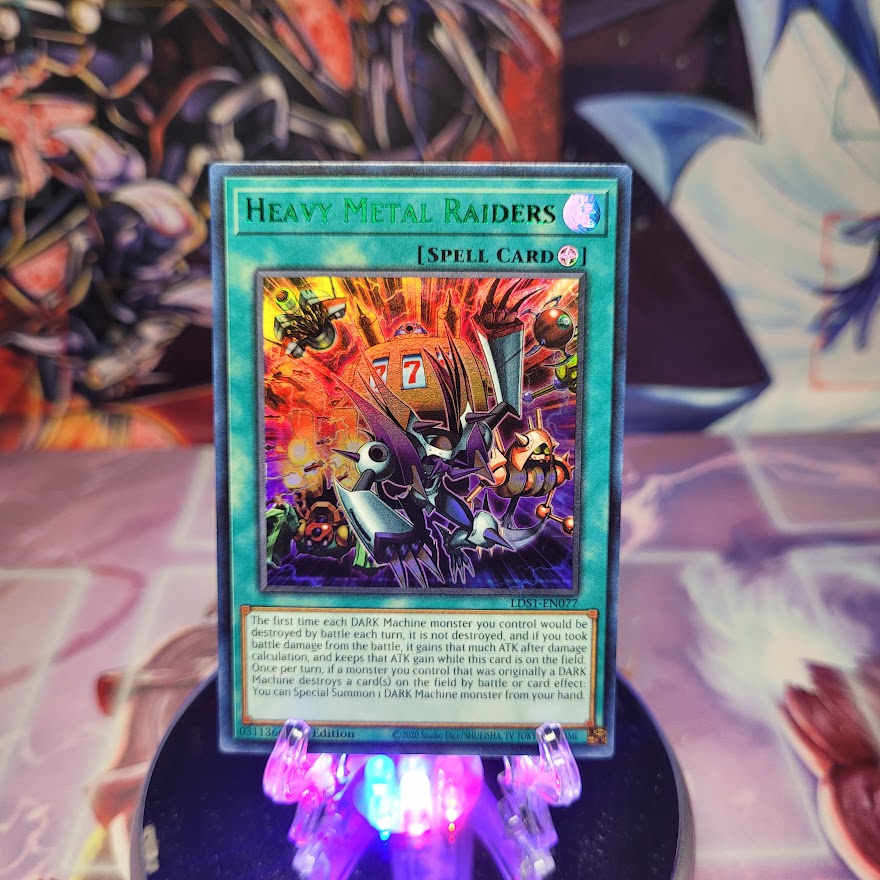 An Ultra Rare Green "Heavy Metal Raiders" card from the Yugioh Set: Legendary Duelists: Season 1.