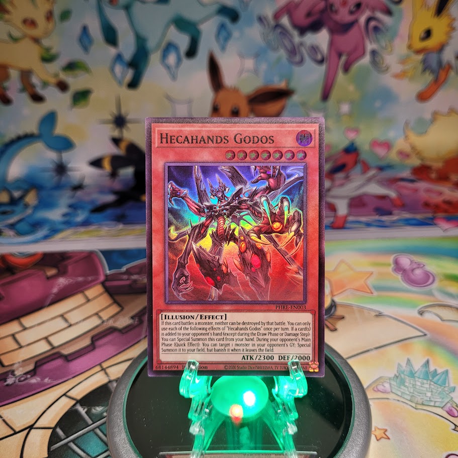 A Super Rare "Hecahands Godos" card from the Yugioh Set: Phantom Revenge (PHRE).