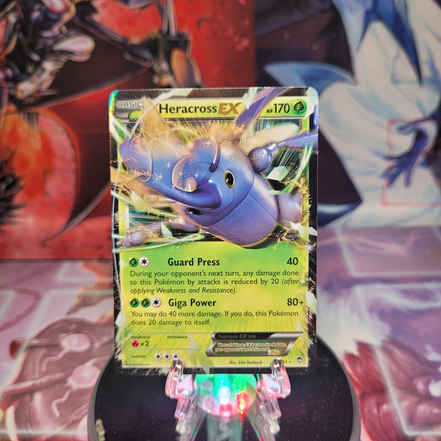 An Ultra Rare "Heracross EX" (4/111) card from the Pokemon Set: XY: Furious Fists.