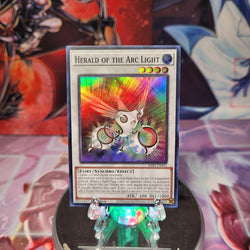 A Super Rare "Herald of the Arc Light" card from the Yugioh Set: Rarity Collection 1 (RA01). 