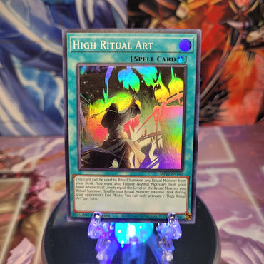  A Super Rare "High Ritual Art" card from the Yugioh 2022 Tin of the Pharaoh's Gods set.