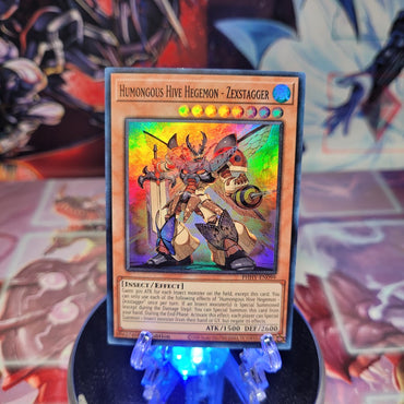 A Super Rare "Humongous Hive Hegemon - Zexstagger" card from the Yugioh Set: Photon Hypernova (PHHY).