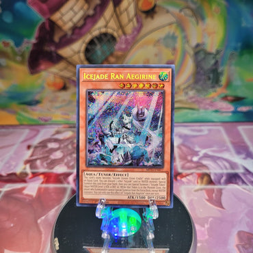 A Prismatic Secret Rare "Icejade Ran Aegirine" card from the Yugioh 25th Anniversary: Dueling Mirrors Tin.