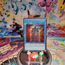 A Secret Rare "Illusion Gate" card from the Yugioh Set: Maze of Muertos (MZMU).