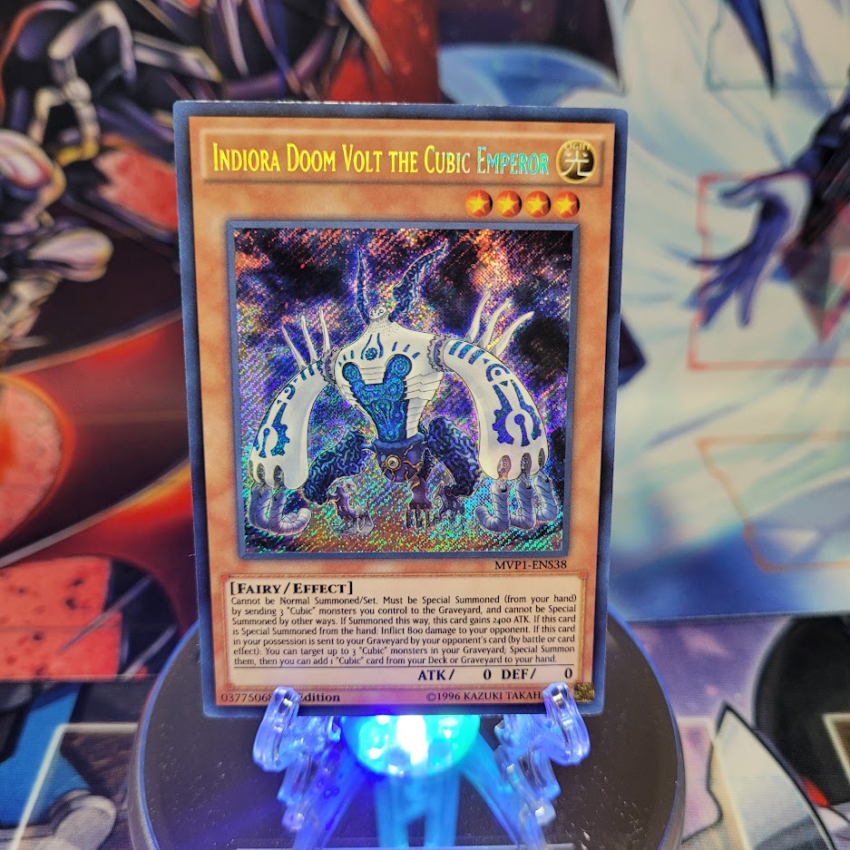 A Secret Rare "Indiora Doom Volt the Cubic Emperor" card from the Yugioh Set: The Dark Side of Dimensions Movie Pack: Secret Edition.