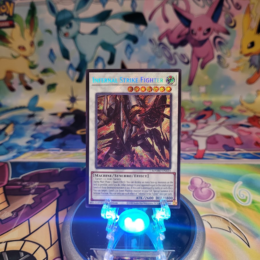 A Secret Rare "Infernal Strike Fighter" card from the Yugioh Set: Magnificent Monsters (MAMO).