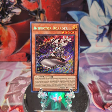 A Secret Rare "Inspector Boarder" card from the Yugioh Set: Rarity Collection 1 (RA01).