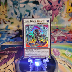 An Ultra Rare "Iron Chain Dragon" card from the Yugioh Set: Magnificent Monsters (MAMO).