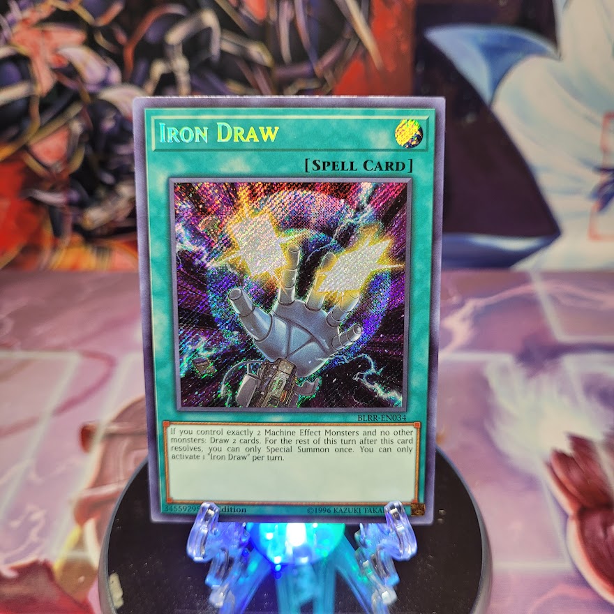 A Secret Rare "Iron Draw" card from the Yugioh Set: Battles of Legend: Relentless Revenge.