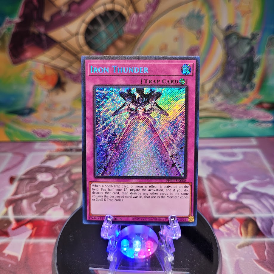 A Secret Rare "Iron Thunder" card from the Yugioh Set: Phantom Nightmare (PHNI).