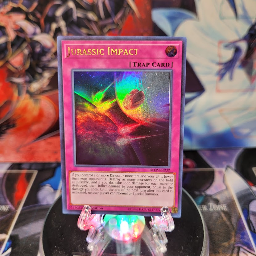 An Ultra Rare "Jurassic Impact" card from the Yugioh Set: Battles of Legend: Light's Revenge.