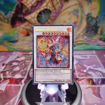 A Secret Rare "Jurrac Meteor" card from the Yugioh Set: Battles of Legend: Monster Mayhem (BLMM).