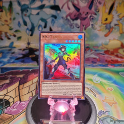 An Ultra Rare "K9-17 Izuna" card from the Yugioh Set: Magnificent Monsters (MAMO).