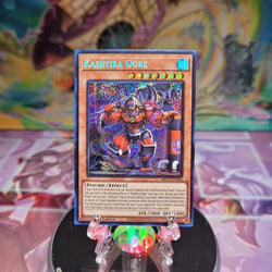 A Prismatic Secret Rare "Kashtira Ogre" card from the Yugioh 25th Anniversary Dueling Heroes Mega-Tin Mega Pack.