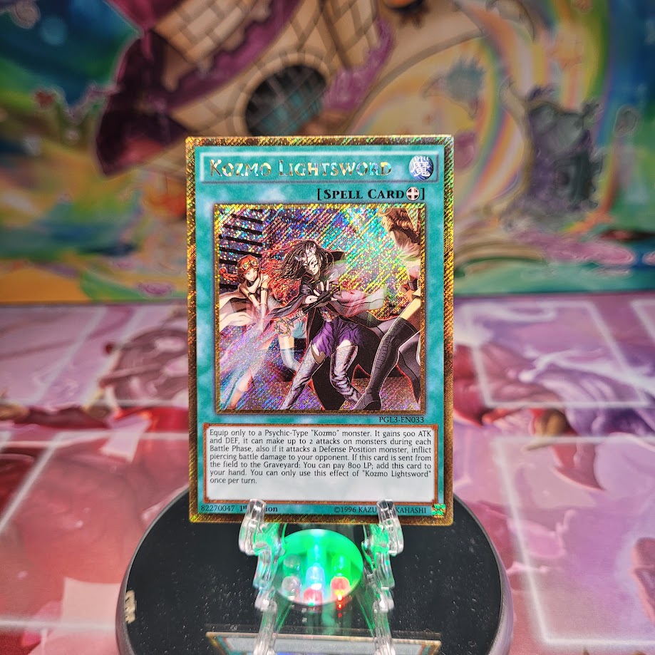A Gold Secret Rare "Kozmo Lightsword" card from the Yugioh Set: Premium Gold: Infinite Gold (PGL3).
