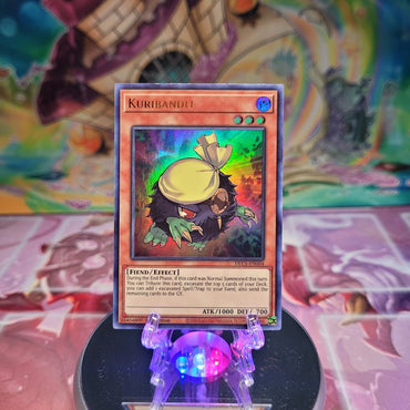 An Ultra Rare "Kuribandit" card from the Yugioh Set: Dragons of Legend: The Complete Series (DLCS).