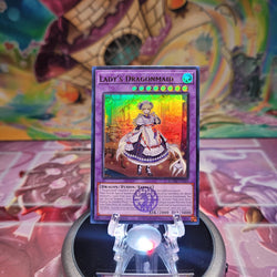 An Ultra Rare "Lady's Dragonmaid" card from the Yugioh Set: Battles of Legend: Monster Mayhem (BLMM).