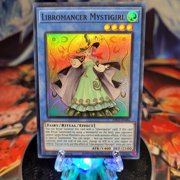  A Super Rare "Libromancer Mystigirl" card from the Yugioh Set: Dimension Force.