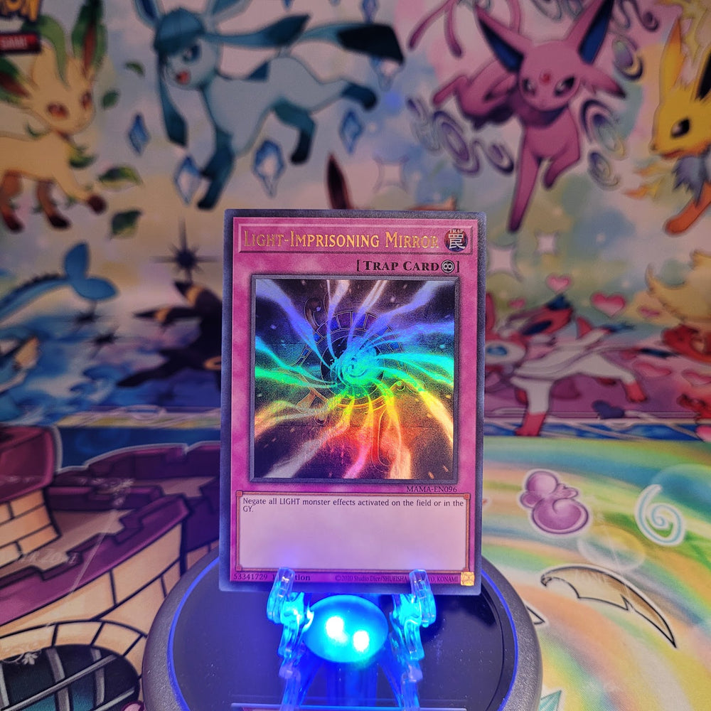 An Ultra Rare "Light-Imprisoning Mirror" card from the Yugioh Set: Magnificent Mavens (MAMA).