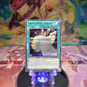  An Ultra Rare "Light Wing Shield" card from the Yugioh Set: Duelist Saga.